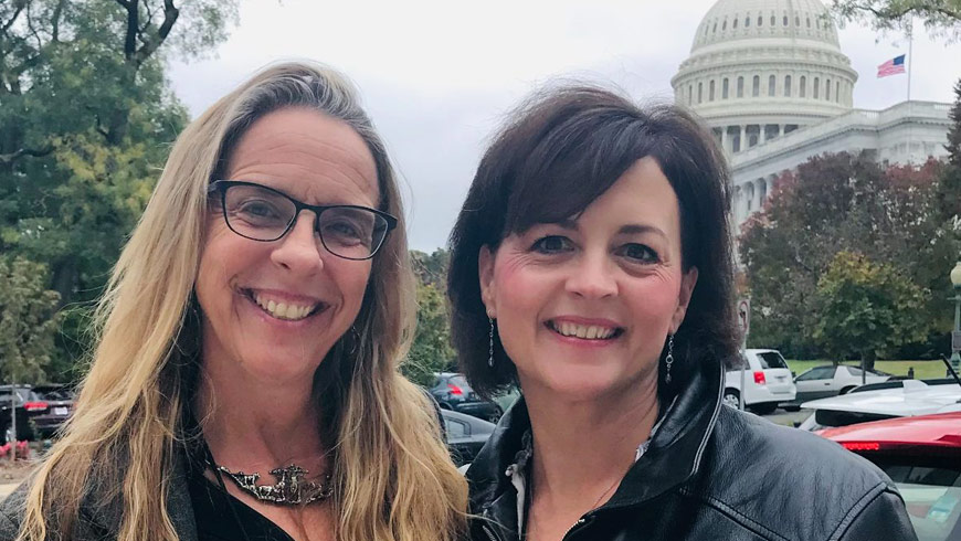 Photo of Jennifer Platt and Beth Carrison in front of capitol building