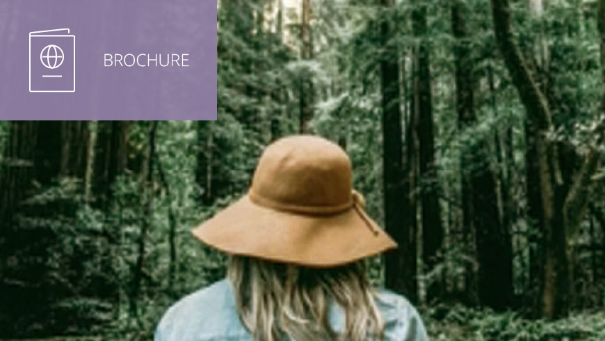 Photo of woman facing the forest wearing a hat and white sans-serif type to left on muted lavender background with brochure icon