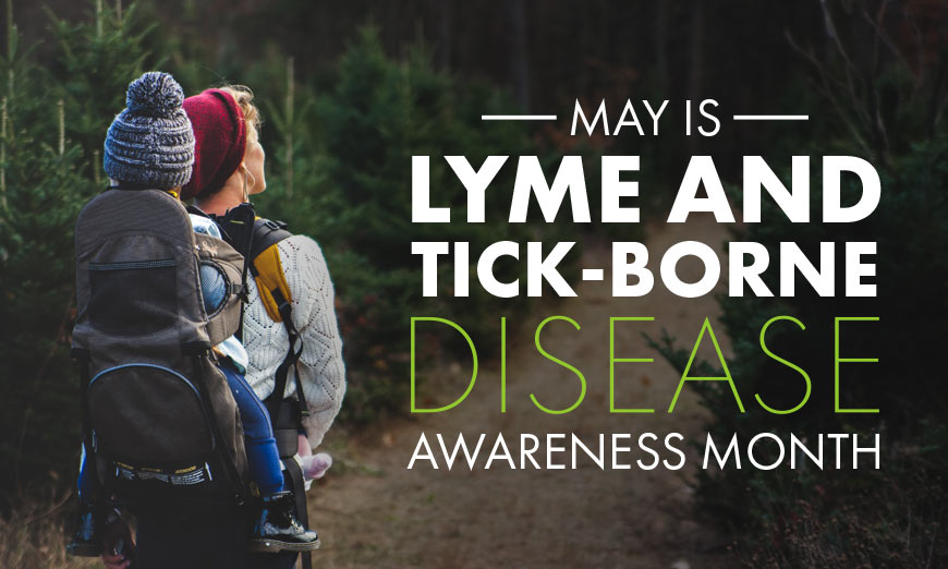 Graphic showing white and green sans-serif type over photo of a woman walking with her toddler in the woods